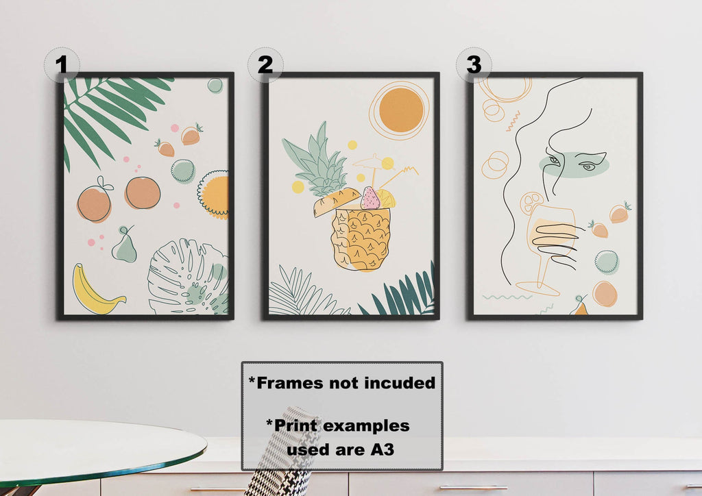 Three Wall Funk prints: floral fruit, pineapple drink & abstract face. Custom sizes. Table with round top below.