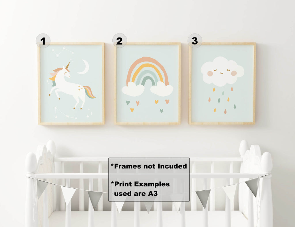 Three custom-sized Wall Funk NP#46 nursery prints: unicorn, rainbow with hearts, and smiling cloud with raindrops above a crib.