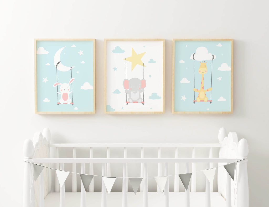 Three Wall Funk safari animal prints (NP#23) hang above a white crib with silver bunting.