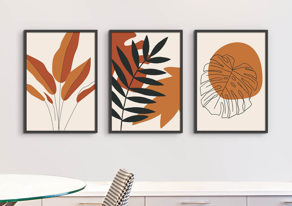 Three "Floral Abstract Wall Art" prints by Wall Funk showcase earthy leaves in orange, green, white. Custom sizes available.