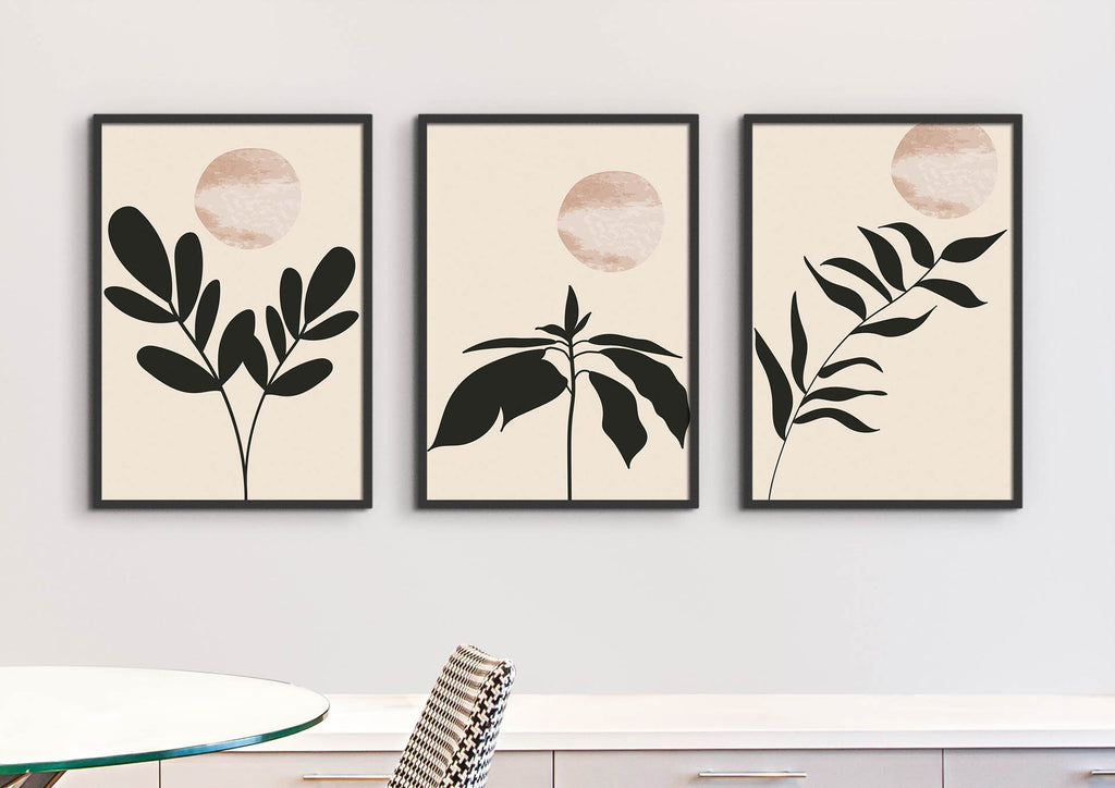 Wall Funk's Contemporary Botanical Flowers art prints, featuring abstract leaves and sun, adorn the wall above a glass table and chair.