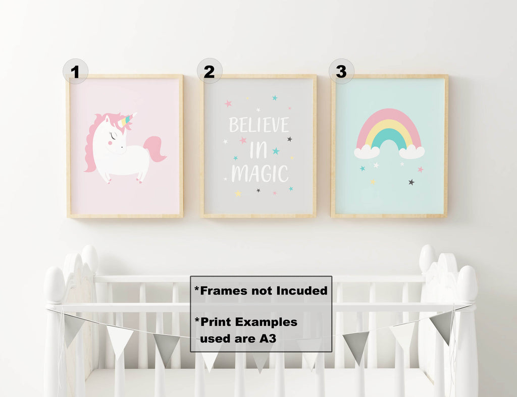 Wall Funk's NP#37 Unicorn Nursery Art Prints above a crib; unicorn, "Believe in Magic," and rainbow prints. Bunting included. Custom sizes.