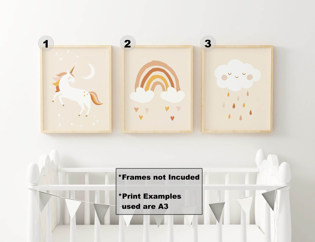 Three Wall Funk nursery prints above a white crib: unicorn, rainbow with clouds, and smiling cloud with rain (NP#45).