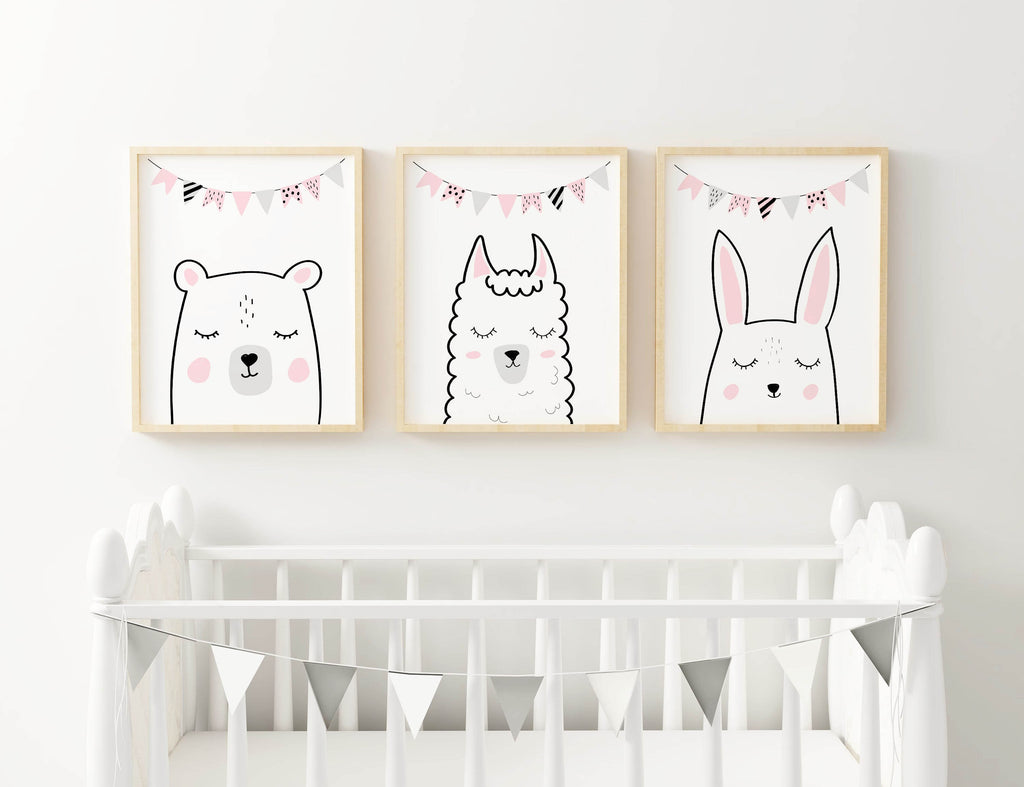 Three high-quality Wall Funk Safari Nursery Prints (bear, llama, rabbit) above a white crib with bunting. Custom sizes available.