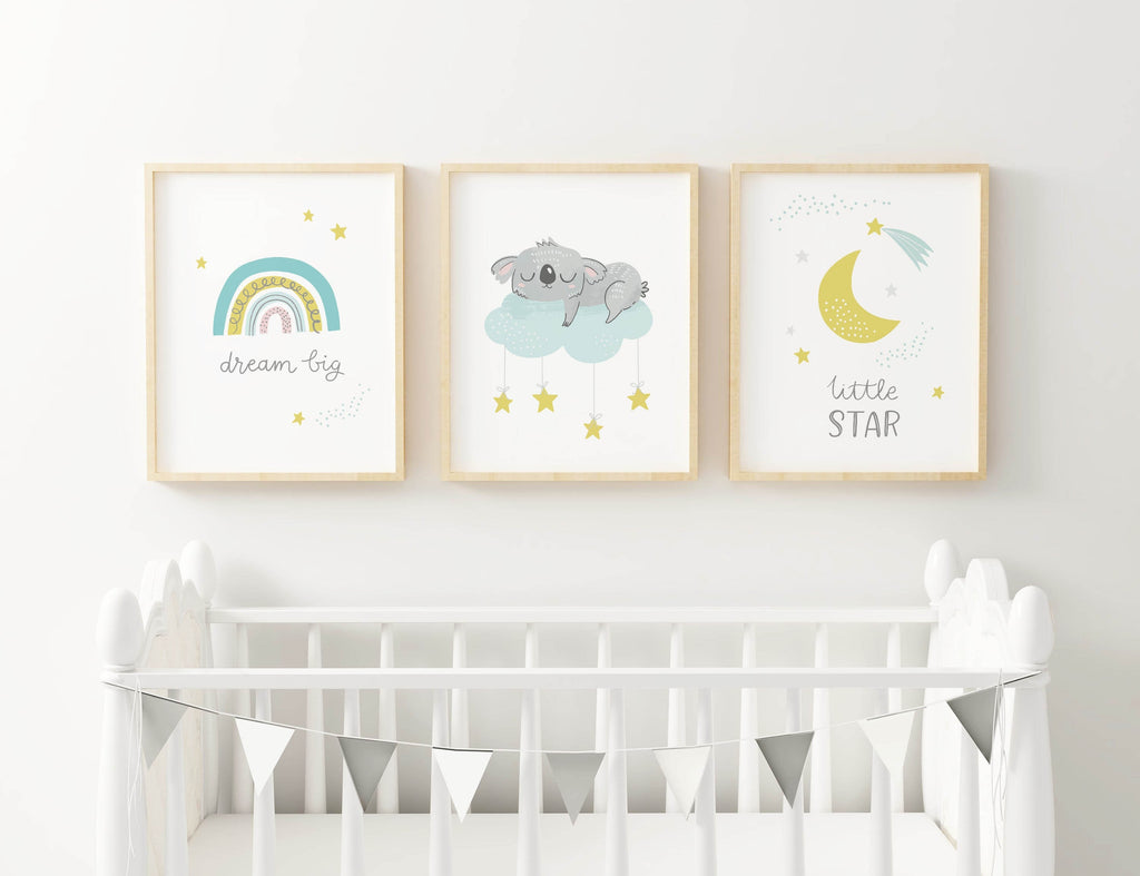 Three Wall Funk Animal Nursery Prints above a crib: "dream big" rainbow, koala on clouds, and crescent moon with "little star.