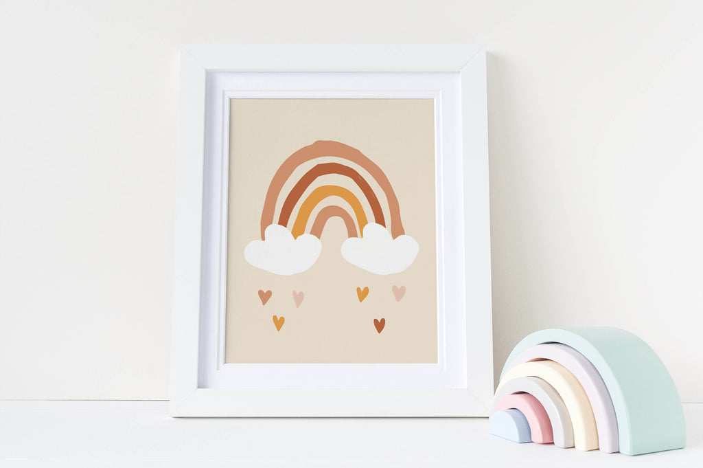 A Wall Funk NP#45 rainbow print with clouds and hearts sits beside a pastel wooden rainbow ornament on the white shelf.