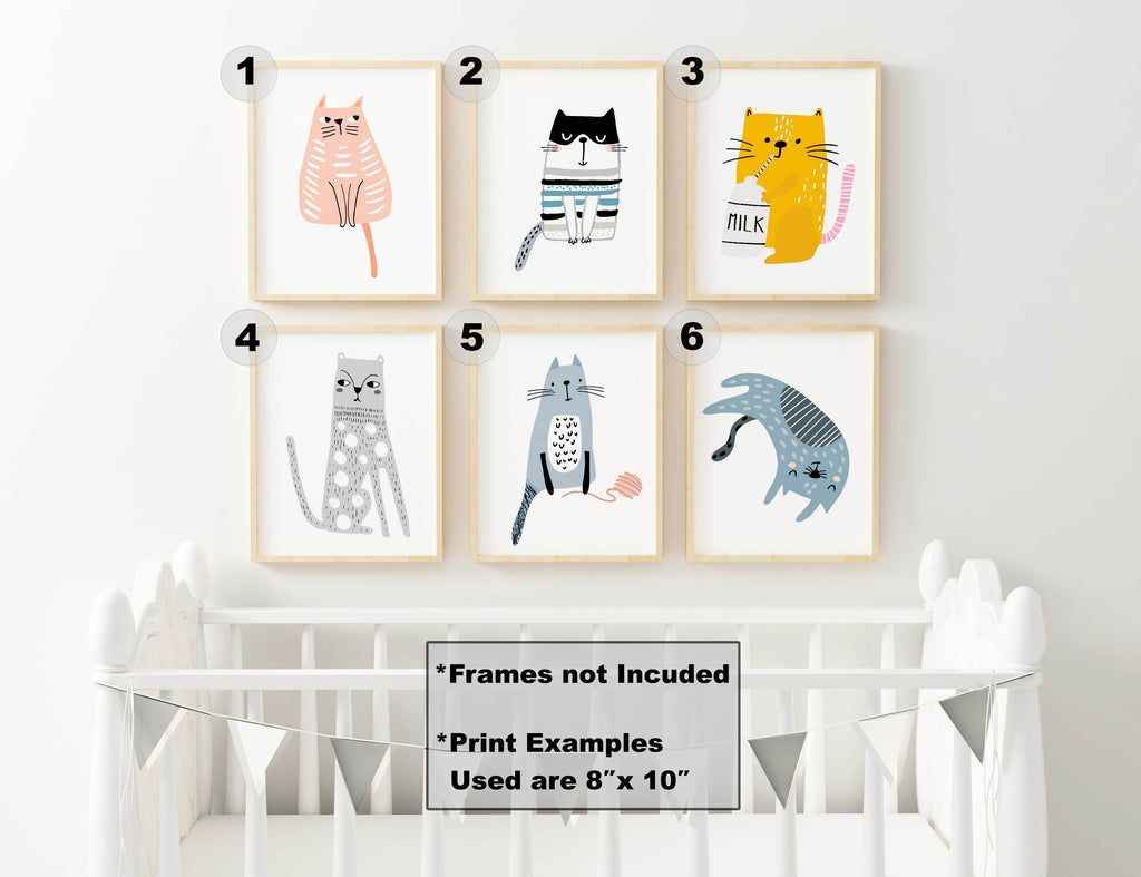 Six Charming Cat Nursery Art Prints by Wall Funk adorn a wall above a crib (frames not included, 8" x 10").