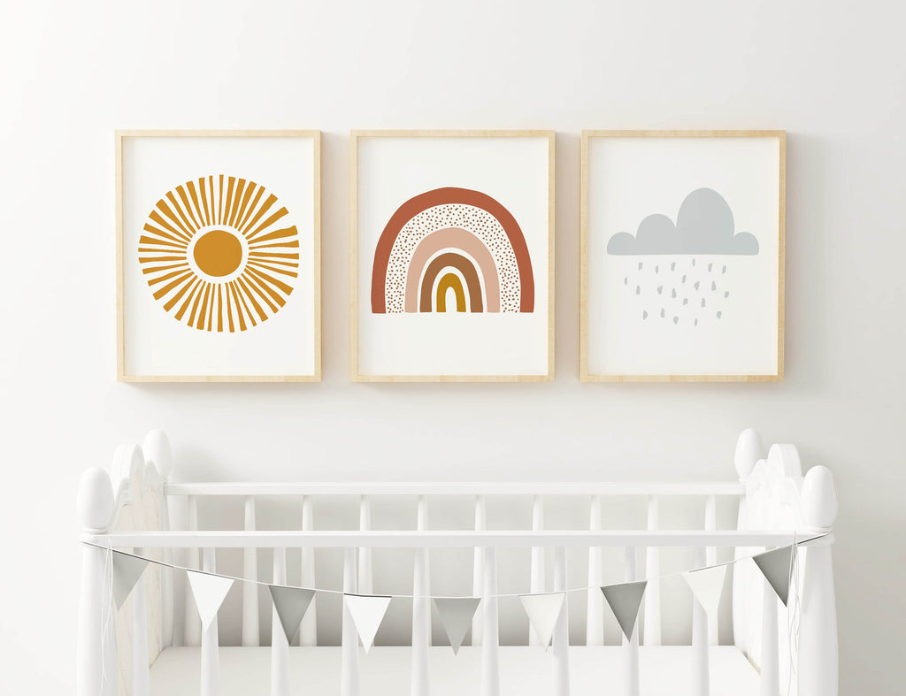 Wall Funk's NP#50: Three nursery art prints featuring a sun, rainbow, and rain cloud over a crib with metallic bunting.