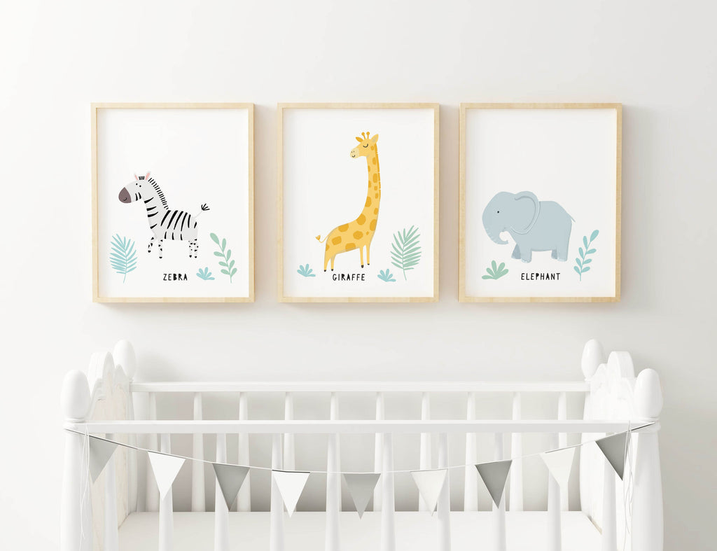 Wall Funk's Safari Nursery Art Prints (zebra, giraffe, elephant) are displayed above a white crib with a bunting.