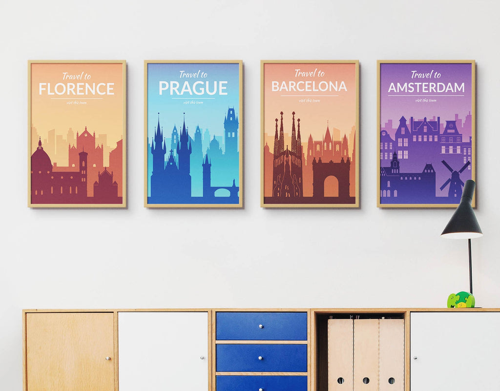 Wall Funk's TP#01 travel prints of Florence, Prague, Barcelona, and Amsterdam adorn the wall above a modern cabinet with a lamp. Custom sizes.