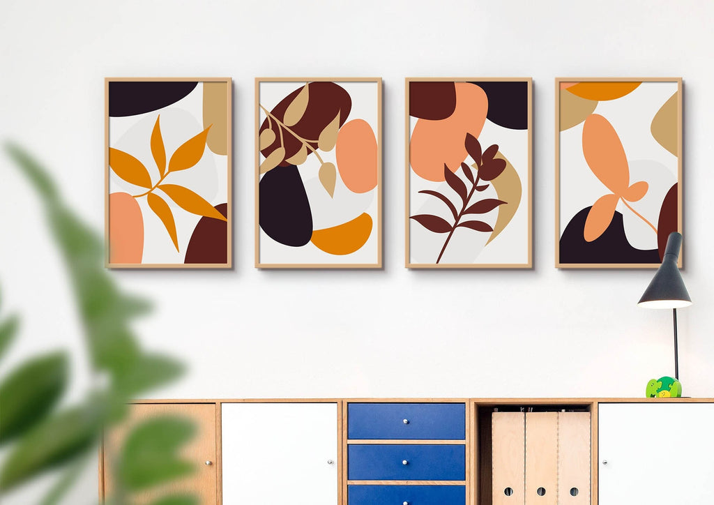 Four Wall Funk "Floral Abstract" pieces with orange, brown & yellow shapes are on a white wall above a cabinet with custom size options.