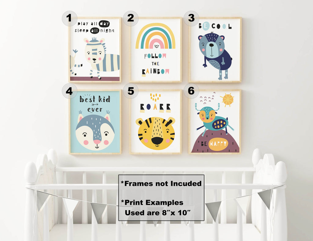 White crib with six Wall Funk "Charming Nursery Wall Art Prints" of whimsical animals and vibrant rainbows above.