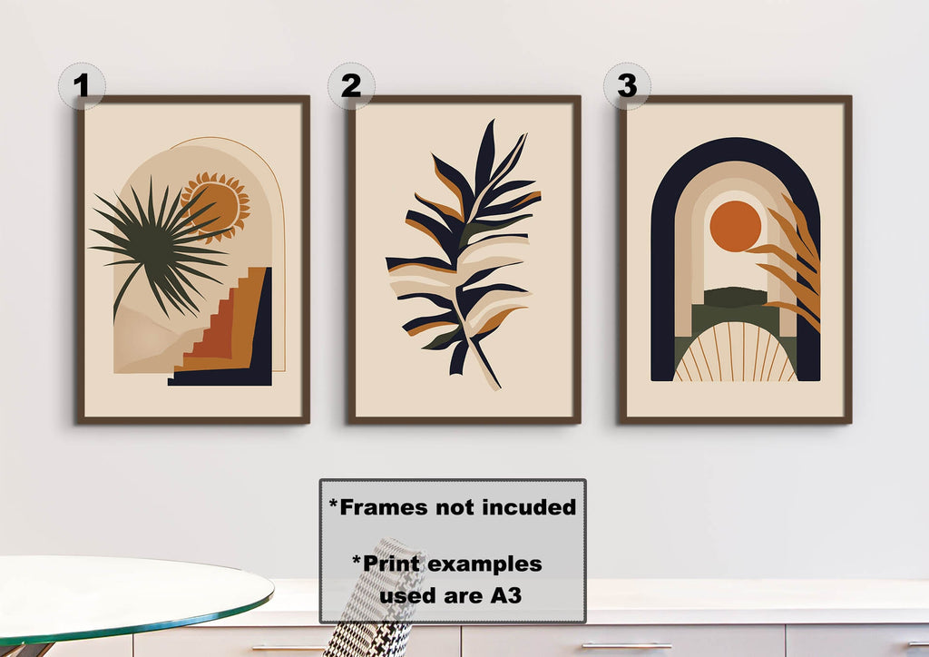 Three Floral Abstract Wall Art prints by Wall Funk, numbered 1-3, with earthy tones adorn the wall above a white table. Frames excluded.