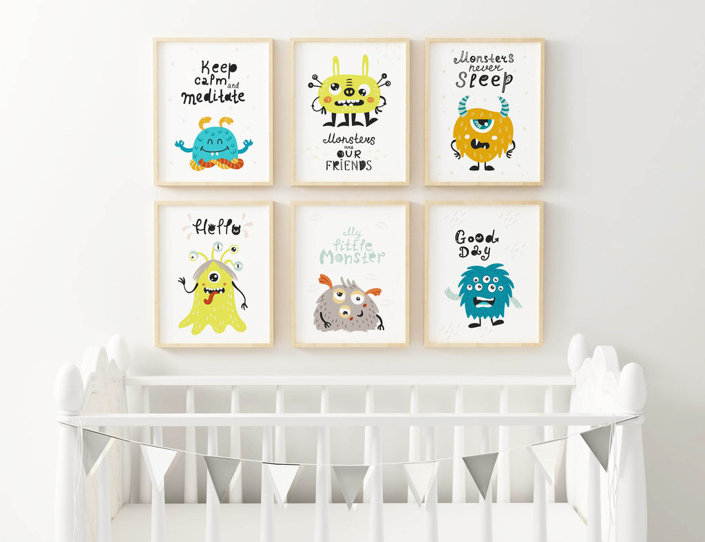 Nursery wall features Cute Colourful Monster Theme Children's Wall Art Prints by Wall Funk above a white crib and buntings.