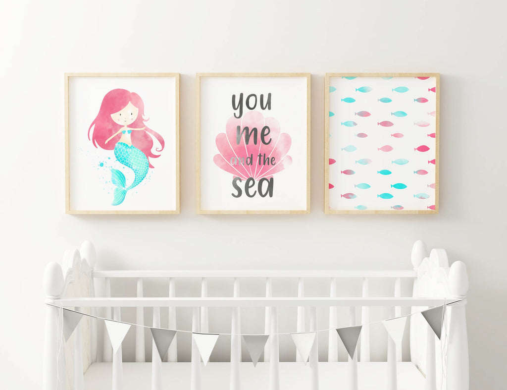 Wall Funk's Charming Mermaid and Sea-Themed Nursery Art Prints feature a mermaid, "you me and the sea" text, and colorful fish.