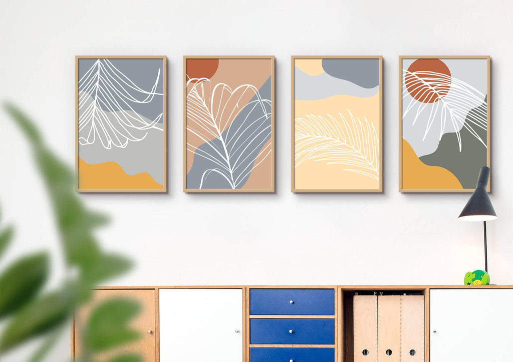 Wall Funk's Botanical Abstract Prints, featuring four unique floral designs, hang above a blue cabinet with a black lamp on the right.