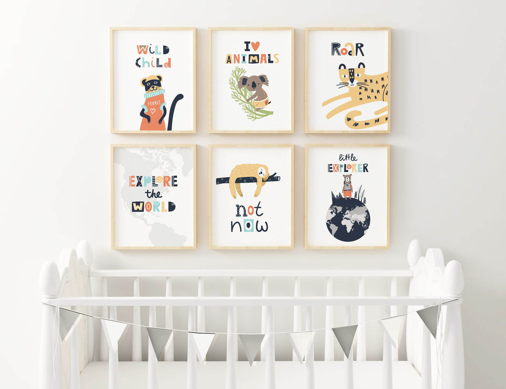 Wall Funk's Charming Nursery Art Prints featuring animal themes adorn the wall above a white crib with decorative bunting.