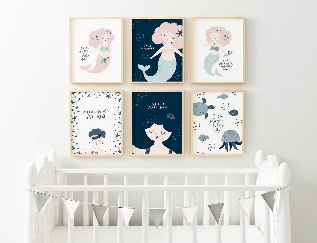 Nursery with Wall Funk's "Enchanting Mermaid" prints above a white crib and decorative banner.