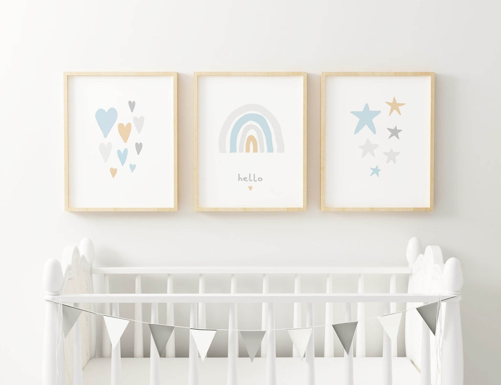 Minimalist nursery with a white crib and Wall Funk's NP#39 high-quality heart, rainbow, and star prints. Silver bunting decorates the crib.