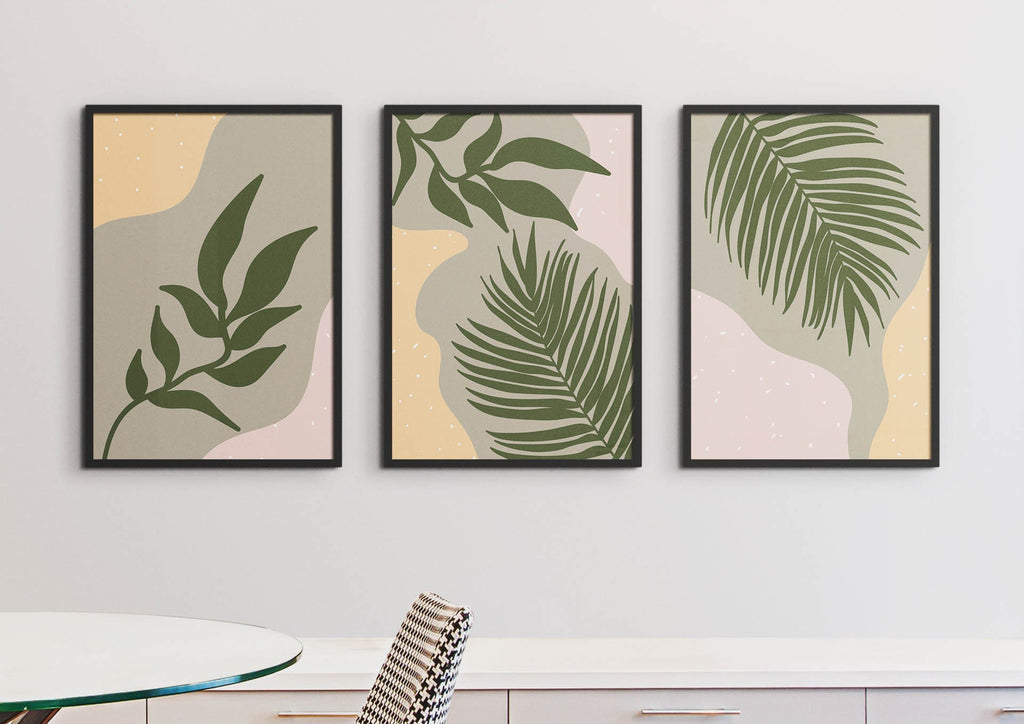 Wall Funk's Floral Abstract Wall Art with green leaves on a pastel background decorates a white wall above the table.