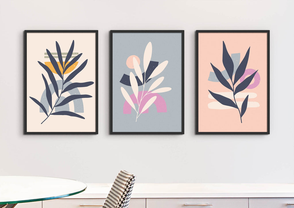 Floral Abstract Wall Art by Wall Funk, three framed prints on a wall above a table with a striped chair, for a luxurious touch.