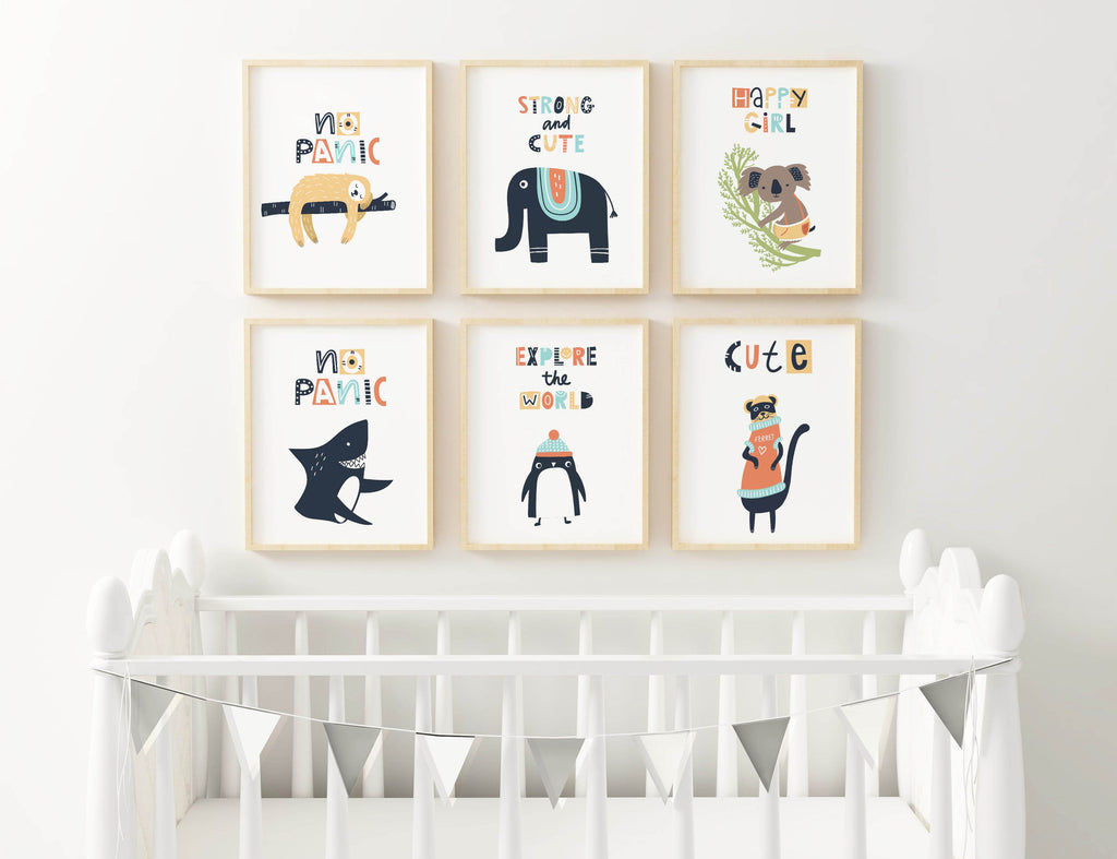 A nursery with six "Scandinavian Boho Style Children's Art Prints" by Wall Funk above a white crib; a small bunting hangs across it.