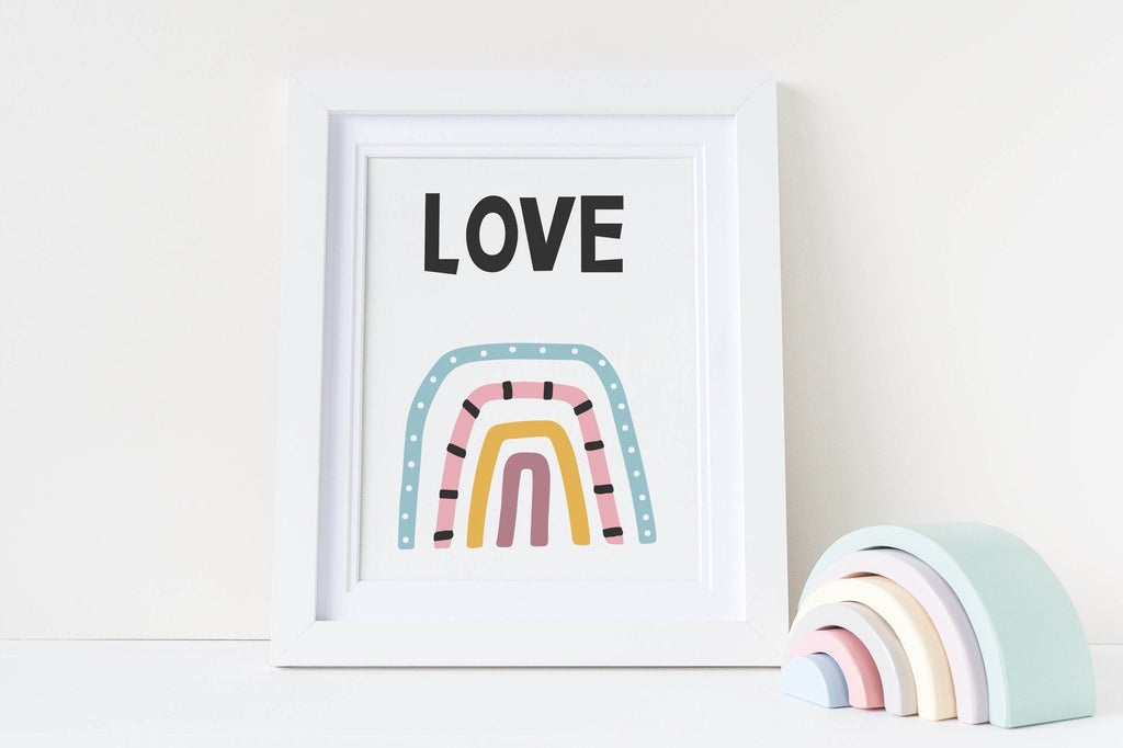 Wall Funk's Charming Collection: "Love" print with pastel rainbow and matching wooden rainbow decor for a whimsical nursery atmosphere.