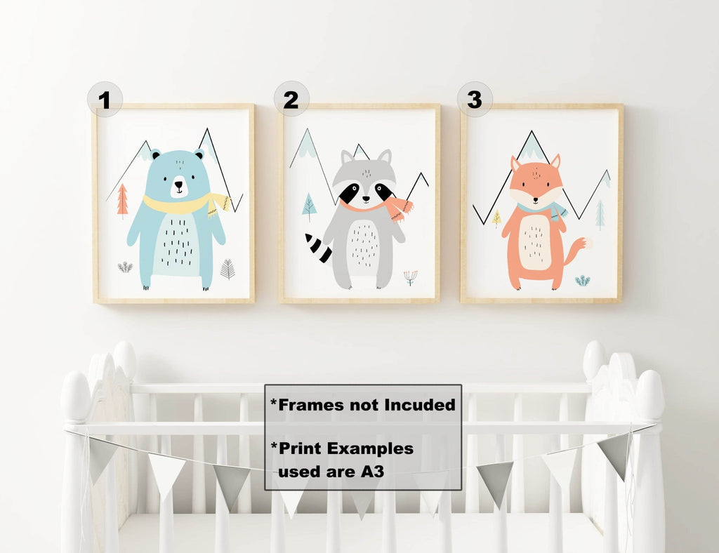 Wall Funk's animal wall art prints—bear, raccoon, and fox—adorn a crib with a banner for a charming nursery.