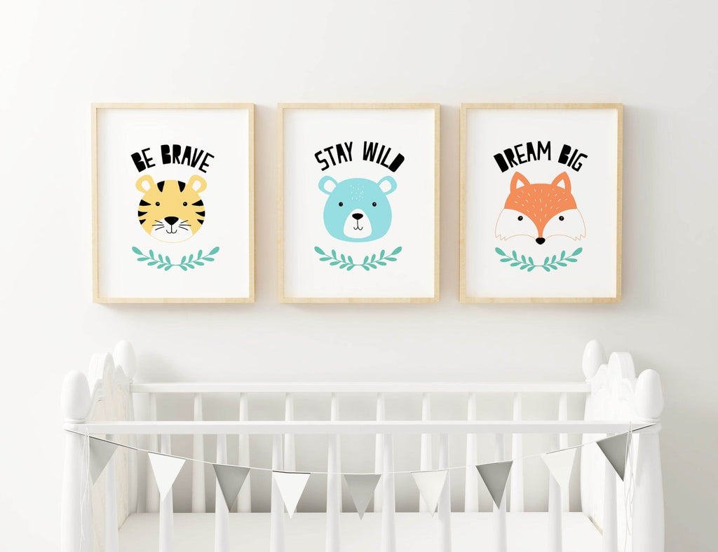 Charming Animal Nursery Art Prints from Wall Funk above a white crib with a black and white triangular garland.