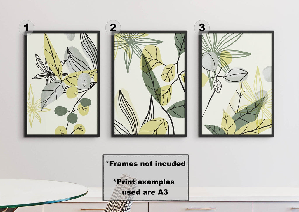 Wall Funk's Watercolour Green Leaves Floral Abstract Wall Art Prints are displayed above a round white table, crafted on high-quality stock.