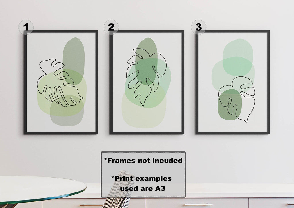 Set of 3 Floral Abstract Wall Art prints by Wall Funk, minimalist green plant shapes, unlabeled on a light wall. Frames not included.