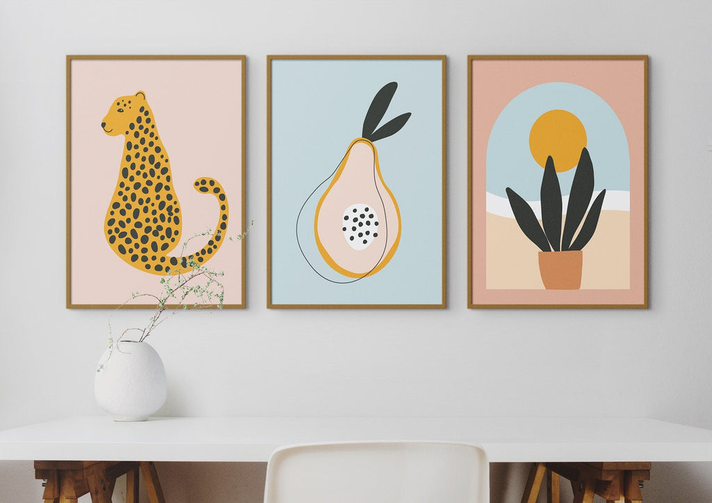 Floral Abstract Wall Art by Wall Funk: three art prints (cheetah, pear, plant under sun) above a desk. Custom sizes available.