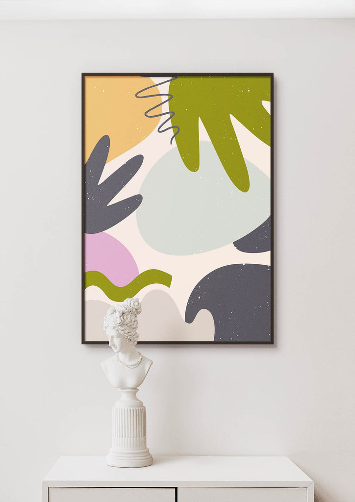 A Floral Abstract Wall Art by Wall Funk, featuring organic shapes and colors, is framed above a bust on a white cabinet.