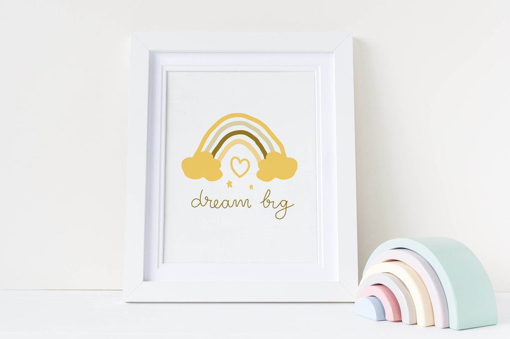 Wall Funk's "Dream Big" nursery art print features a yellow rainbow and pastel decor, available in custom sizes for your child's room.