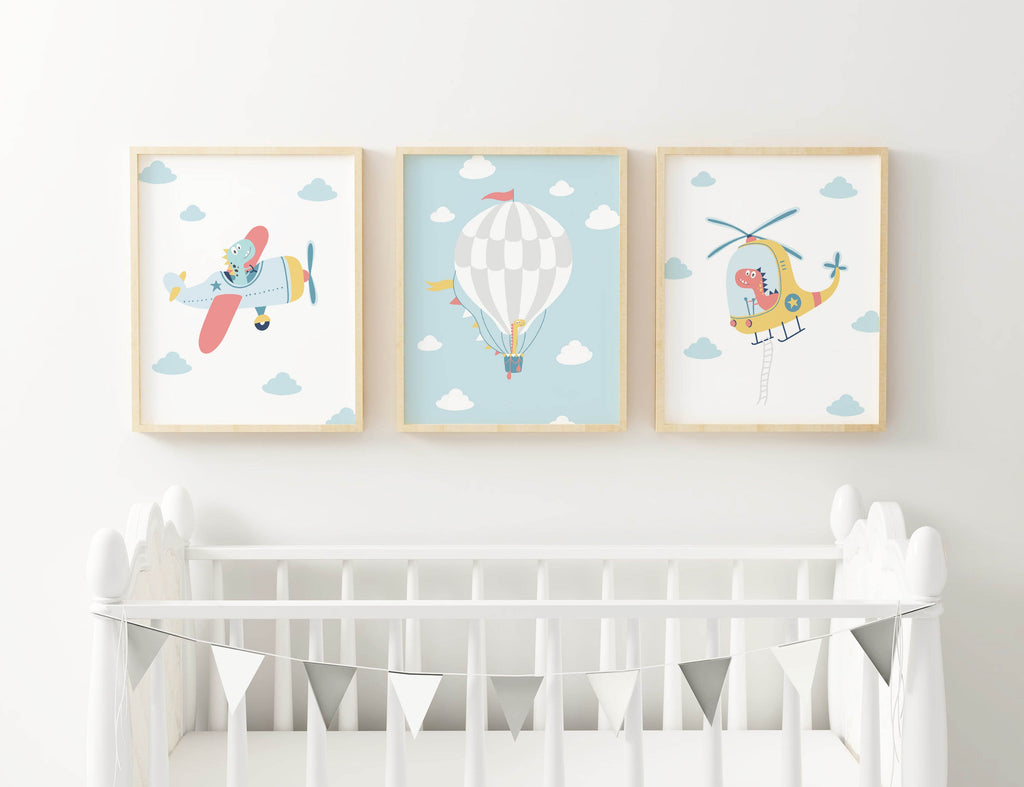 Three Cute Boho Dinosaur themed prints by Wall Funk above a white crib with bunting.