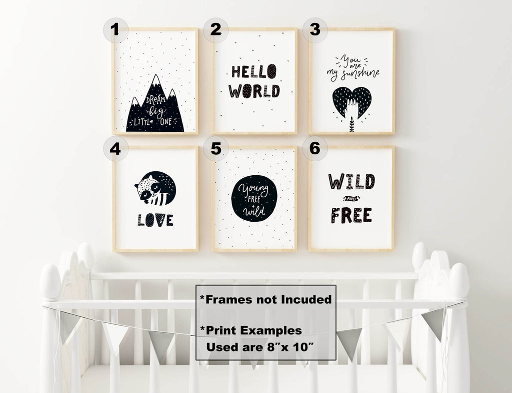 Wall Funk's Charming Boho Nursery Art Prints set decorates the wall above a crib with inspirational quotes and starry, dotted designs.