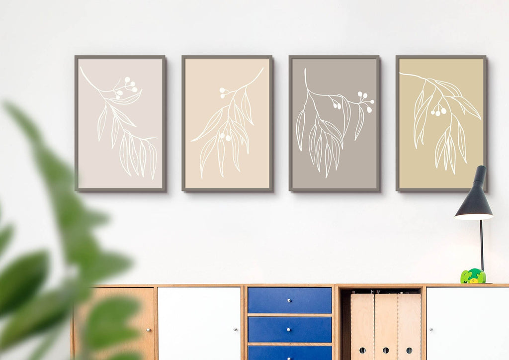 Four custom-size Floral Abstract Wall Art prints by Wall Funk above a cabinet with a lamp and plant add charm to your space.