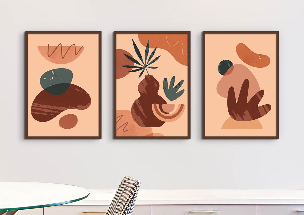 Floral Abstract Wall Art by Wall Funk: Three earthy-toned, organic-shaped pieces on a white wall above table and chair; custom sizes available.