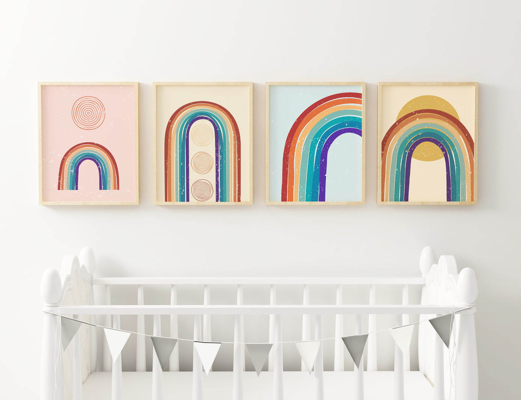 Four framed Rainbow Nursery Art Prints by Wall Funk above a crib; available in custom sizes.