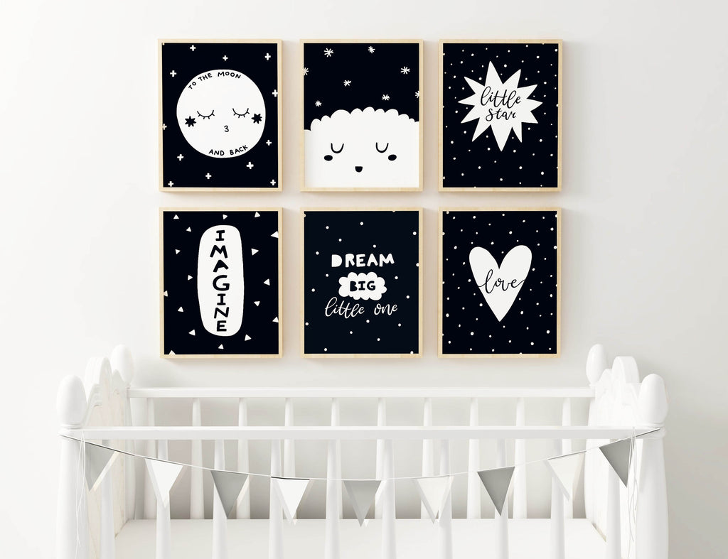 A white crib sits before a wall with Wall Funk's Whimsical Nursery Art Set, featuring stars, moons, and dreamy quotes.