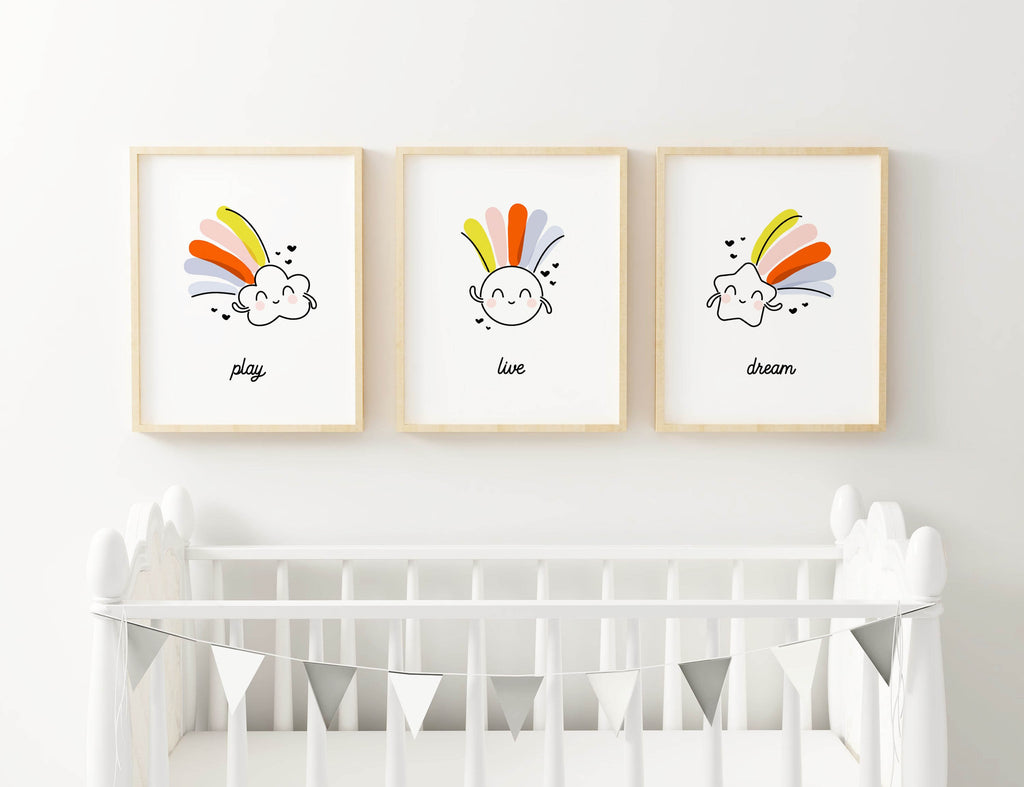 Three "Dream Big" rainbow prints by Wall Funk hang above a crib with bunting, available in custom sizes. Model: NP#43.