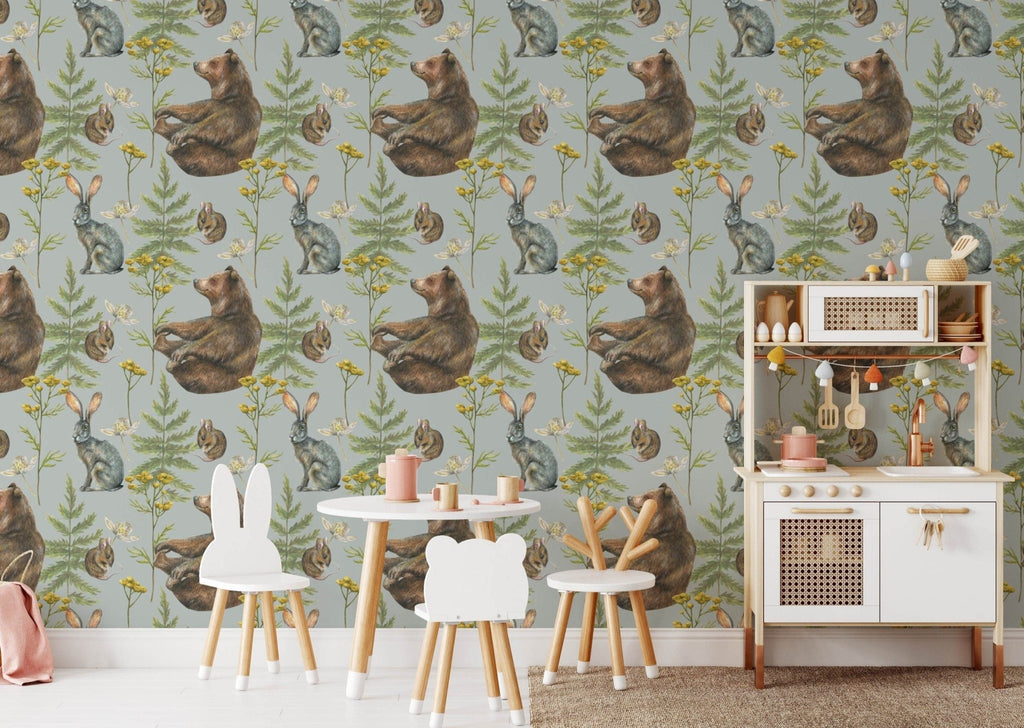 a child's room with a wallpaper with a bear and flowers